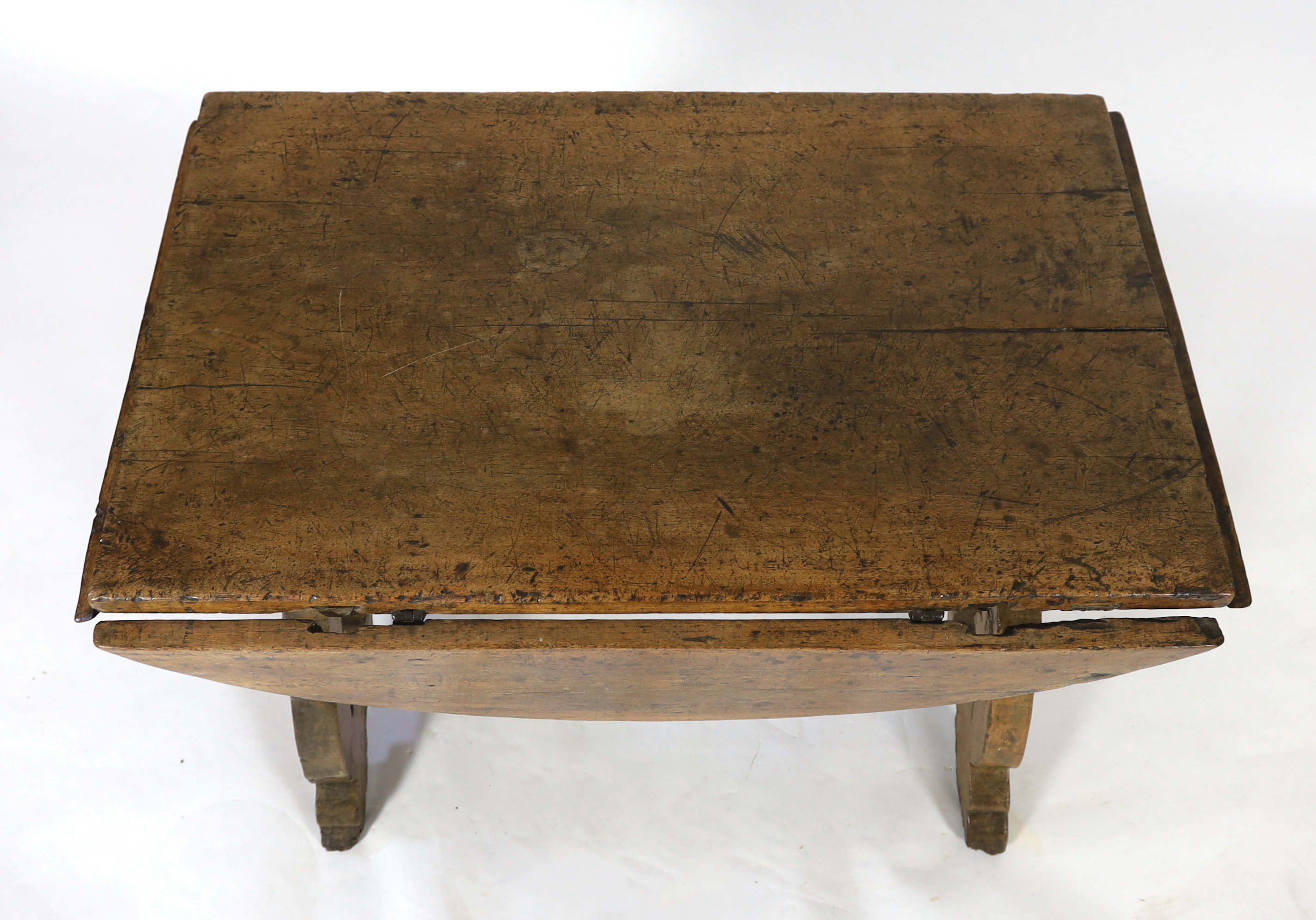 A mid 17th century Spanish walnut dining table, 115 x 74cm with flaps down, height 78cm